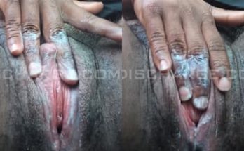 Black woman covering her fingers in creamy pussy discharge